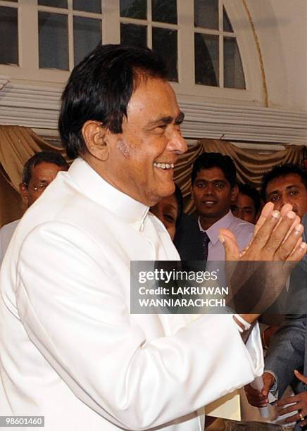 New Sri Lankan Prime Minister D. M. Jayaratne gestures during a swearing in ceremony in Colombo on April 21, 2010. Sri Lanka's ruling party named...