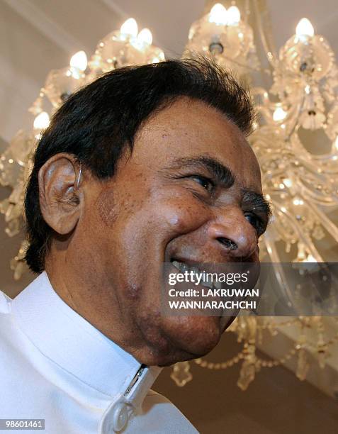 New Sri Lankan Prime Minister D. M. Jayaratne smiles during a swearing in ceremony in Colombo on April 21, 2010. Sri Lanka's ruling party named...