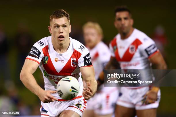 Cameron McInnes of the Dragons passes during the round 16 NRL match between the St George Illawarra Dragons and the Parramatta Eels at WIN Stadium on...
