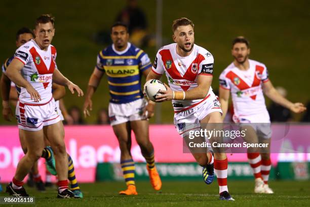 Jacob Host of the Dragons passes during the round 16 NRL match between the St George Illawarra Dragons and the Parramatta Eels at WIN Stadium on June...