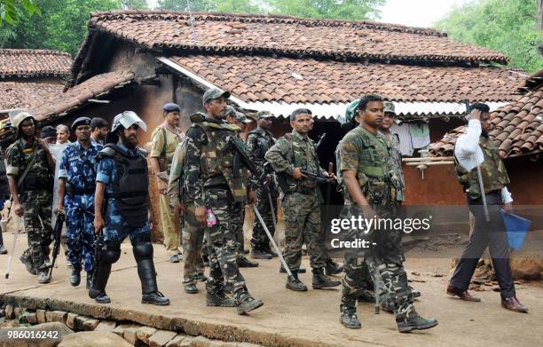 This photo taken on June 27, 2018 shows Indian security forces patrolling around Ghagra village in Khunti district in India's eastern Jharkhand...