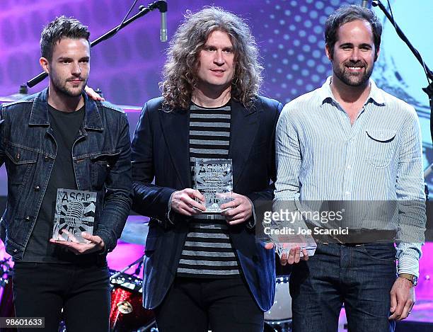 Brandon Flowers, Dave Keuning, and Ronnie Vannucci Jr of The Killers accept their ASCAP Award at the 27th Annual ASCAP Pop Music Awards Show at...
