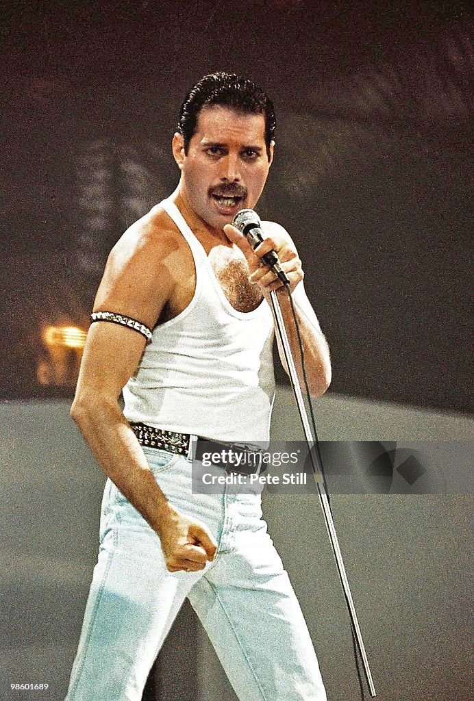 Freddie Mercury of Queen performs on stage at Live Aid on July 13th