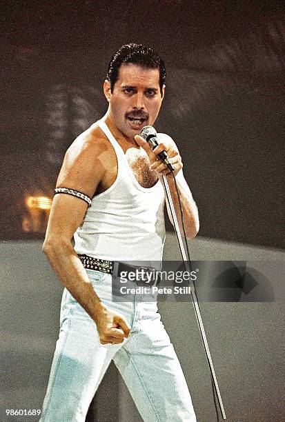 Freddie Mercury of Queen performs on stage at Live Aid on July 13th, 1985 in Wembley Stadium, London, England