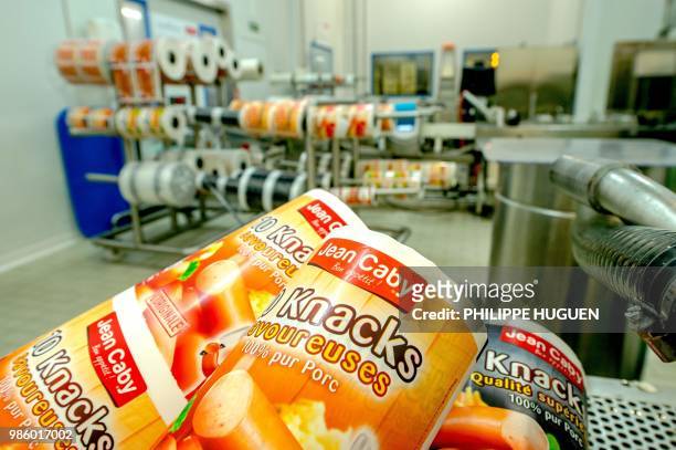 Photo shows packs of cocktail sausages of the Jean Caby company at a warehouse of the site in Saint-Andre-lez-Lille, northern France, on June 28...