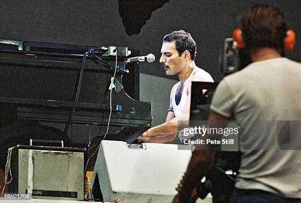 Freddie Mercury of Queen performs on stage at Live Aid on July 13th, 1985 in Wembley Stadium, London, England