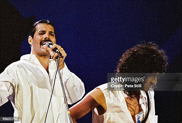 Freddie Mercury and Brian May of Queen perform on stage at Live Aid on July 13th, 1985 in Wembley Stadium, London, England