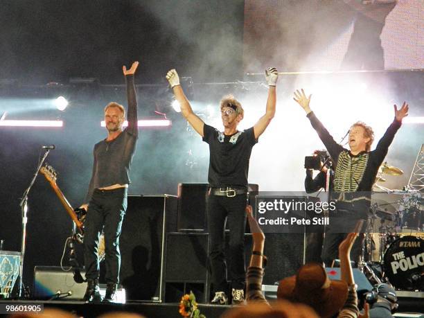 Sting, Stewart Copeland and Andy Summers of The Police take a final bow and wave the crowd farewell after performing on stage on Day 2 of 'Hard Rock...