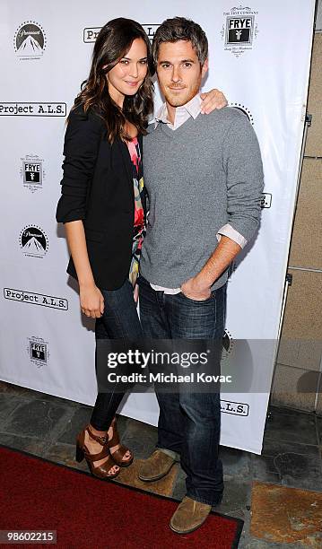 Actor Dave Annable and fiancee actress Odette Yustman arrive at the Project A.L.S. LA Benefit hosted by Ben Stiller & Friends at Lucky Strike Bowling...