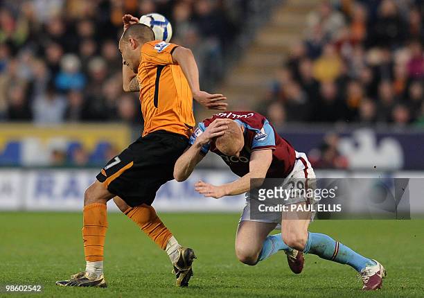 Hull City's English forward Craig Fagan clashes heads with Aston Villa's James Collins during their English Premier League football match at The KC...