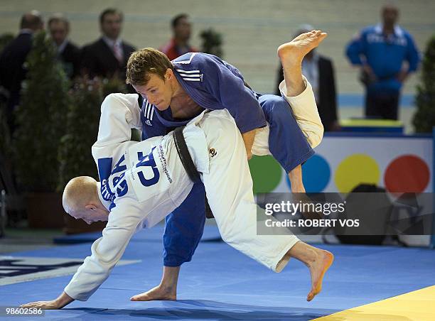 Dutch Jeroen Mooren and British James Millar compete in the mens`s 60 kg judo competition during the Judo European Championships in Vienna on April...