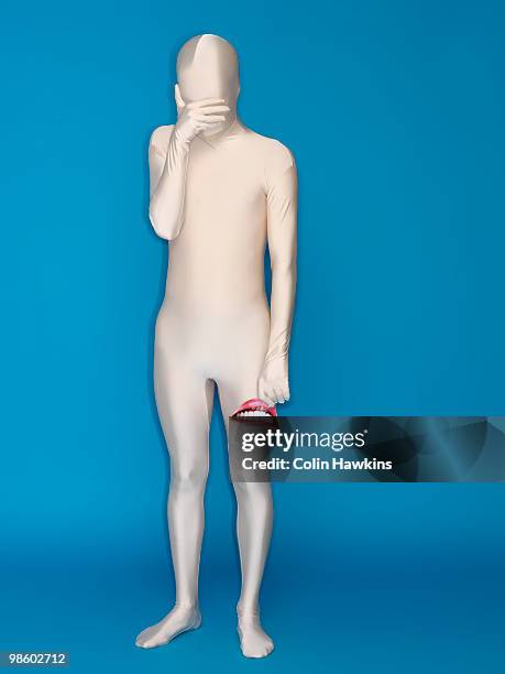 sad man in body suit - colin hawkins stock pictures, royalty-free photos & images