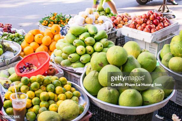 vegetable for sale in outdoor market - loofah stock-fotos und bilder