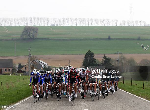 The peloton rides through the Belgian countryside during the 74th Fleche Wallonne Race on April 21, 2010 in Huy, Belgium.