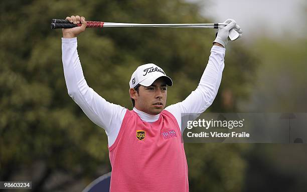 Pablo Larrazabal of Spain stretches before tee off on the 14th hole during Round One of the Ballantine's Championship at Pinx Golf Club on April 22,...