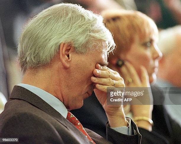German Ambassador to the US, Juergen Chrobog rubs his eyes after hearing Dawn Lopez' account of her stabbing assault by Karl LaGrand, during...