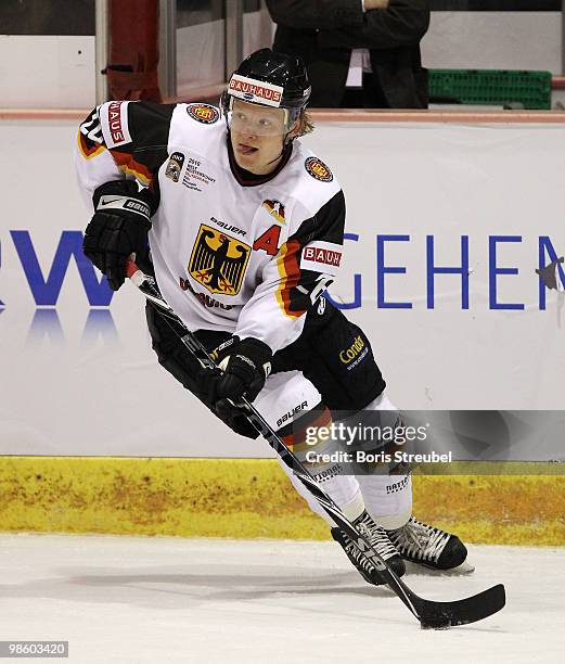 Daniel Kreutzer of Germany controls the puck during the pre IIHF World Championship match between Germany and Norway at the Sahnpark on April 16,...