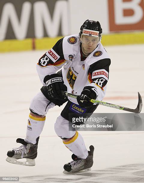 Frank Hoerdler of Germany controls the puck during the pre IIHF World Championship match between Germany and Norway at the Sahnpark on April 16, 2010...