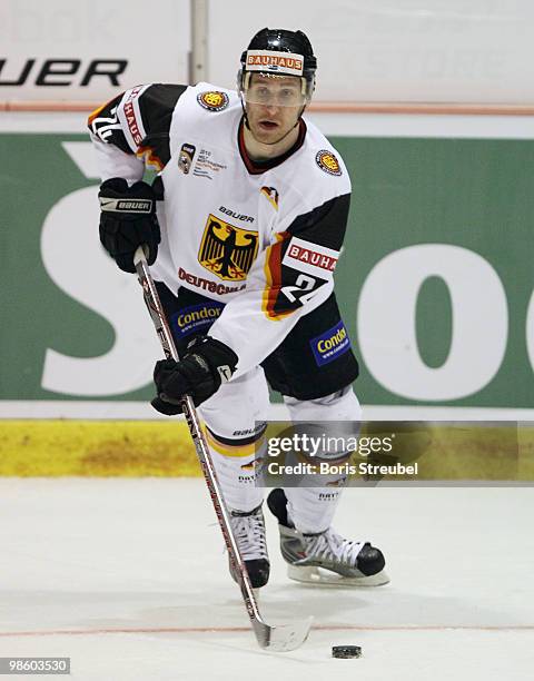 Andre Rankel of Germany controls the puck during the pre IIHF World Championship match between Germany and Norway at the Sahnpark on April 16, 2010...