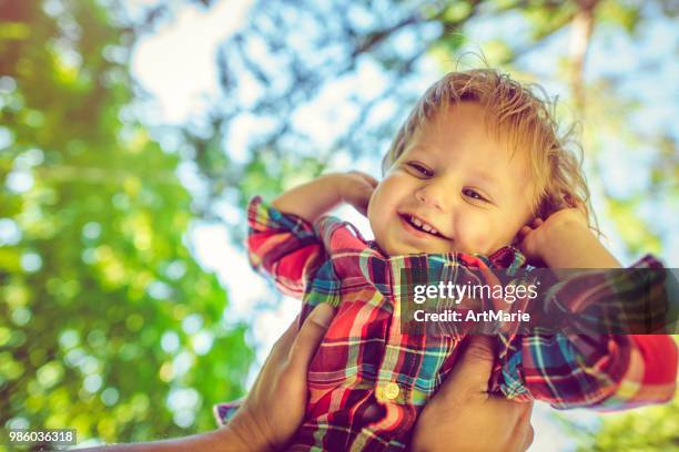 cute child having fun in summer park - artmarie stock pictures, royalty-free photos & images