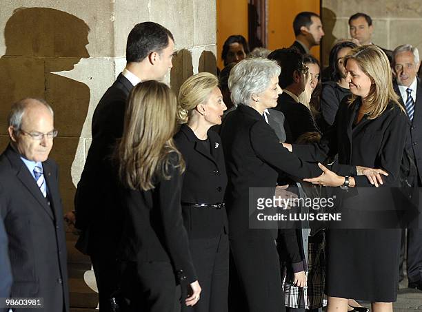 Spain's Princess Cristina greets Lluisa Sallent, partner of former International Olympic Committee president Juan Antonio Samaranch, next to his...