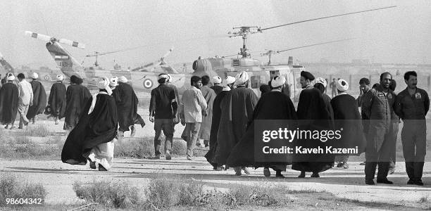Clergymen arrive at a makeshift heliport to attend the funeral of Ayatollah Khomeini at Behesht Zahra cemetery, Tehran 6th June 1989.