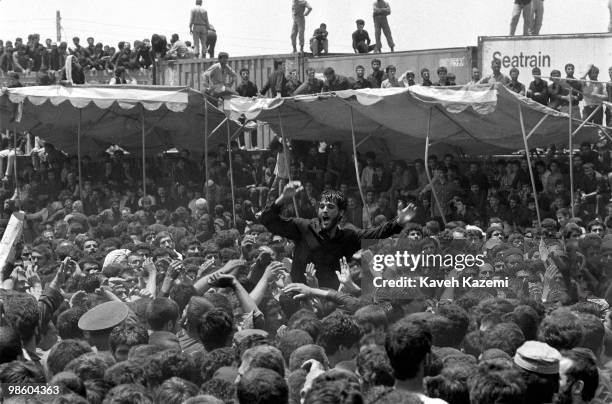 Men dressed in black flagellate and mourn at the funeral of Ayatollah Khomeini at Behesht Zahra cemetery, Tehran 6th June 1989.