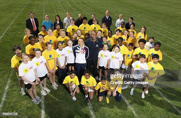 Jessica Ennis and Darren Campbell pose with young atheletes during the the Aviva Elevating Athletics Fund Launch at Gumley House School on April 22,...