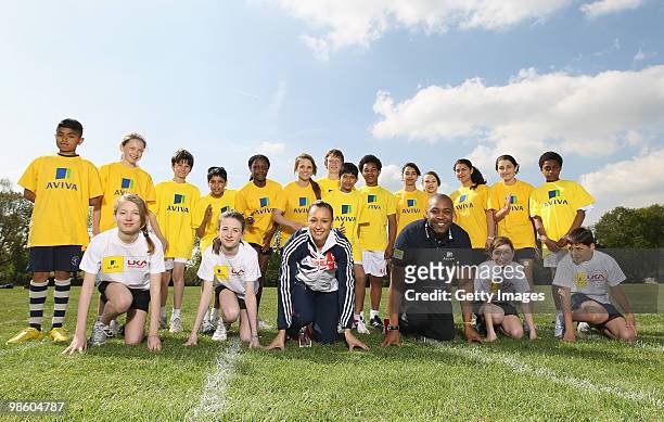 Jessica Ennis and Darren Campbell pose with young atheletes during the the Aviva Elevating Athletics Fund Launch at Gumley House School on April 22,...