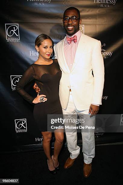 Singer Adrienne Bailon and NY Jets star Darrelle Revis attend the NFL Draft grand opening celebration at Rafaello & Co Jewelers on April 21, 2010 in...