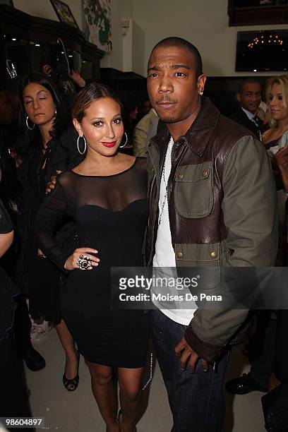 Adrienne Bailon and Ja Rule attend the NFL Draft grand opening celebration at Rafaello & Co Jewelers on April 21, 2010 in New York City.