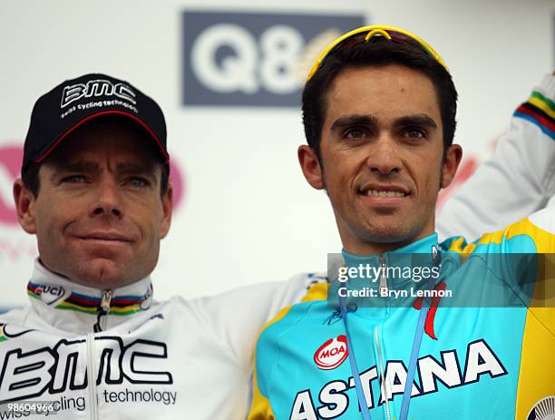 Race winner Cadel Evans of Australia and BMC Racing stands on the podium with third placed Alberto Contador of Spain and Astana during the 74th...