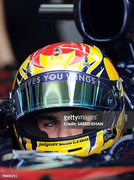 Toro Rosso-Ferrari driver Jaime Alguersuari of Spain prepares for the first practice session for Formula One's Malaysian Grand Prix in Sepang on...