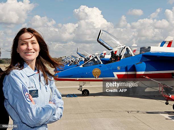 France's first lady Carla Bruni-Sarkozy , patron of the French aerobatic squadron "Patrouille de France" poses after an exhibition in...