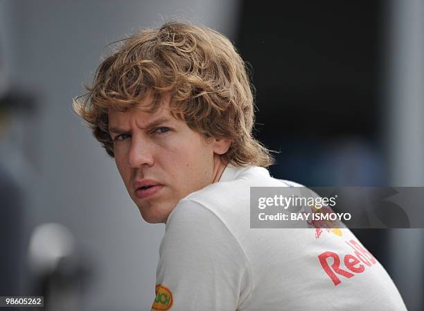 Red Bull-Renault driver Sebastian Vettel of Germany looks on before the first practice session for Formula One's Malaysian Grand Prix in Sepang on...