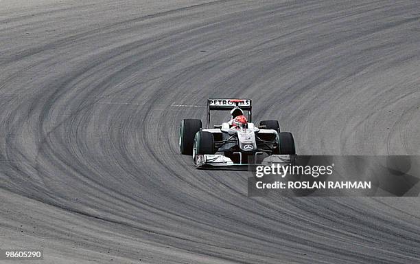 Mercedes driver Michael Schumacher of Germany speeds around the corner during the second practice session for Formula One's Malaysian Grand Prix in...
