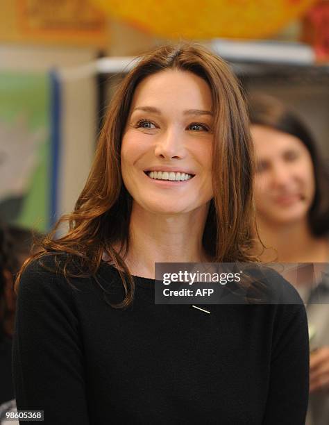 French First Lady Carla Bruni Sarkozy visits at a KIPP school , a school for underprivileged pupils on March 30, 2010 in Washington, DC. AFP...