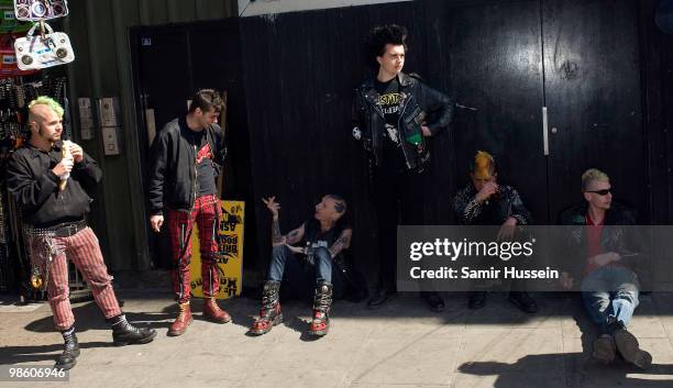 Punks await the Malcolm McLaren funeral procession to pass through Camden Town on its way to Highgate cemetery, on April 22, 2010 in London, England....