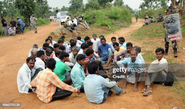 This photo taken on June 27, 2018 shows Indian men allegedly aligned to Pathalgadi -- a popular indigenous tribal movement -- detained by security...