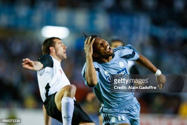 Didier Drogba of Marseille Carlos Marchena of Valencia during the Uefa cup final match between Valencia and Marseille at Ullevi, Goteborg, Sweden on...