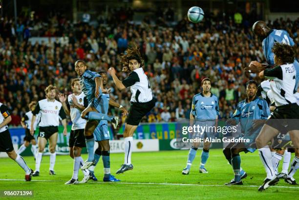 Steve Marlet of Marseille, Roberto Ayala of Valencia and Abdoulaye Meite of Marseille during the Uefa cup final match between Valencia and Marseille...