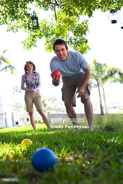 couple playing bocce ball - bocce ball stock pictures, royalty-free photos & images