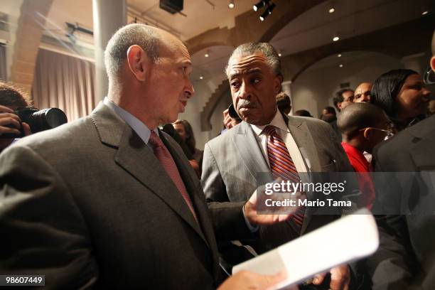 Goldman Sachs CEO Lloyd Blankfein chats with Reverend Al Sharpton before U.S. President Barack Obama's speech on financial regulation at Cooper Union...