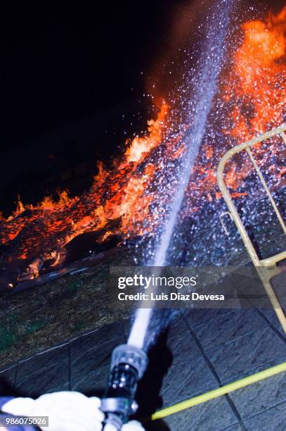 2018 festivities of saint juan - fireman fighting fire - silva v diaz stock pictures, royalty-free photos & images