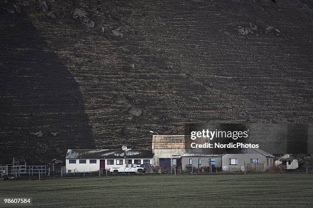 Farmhouses and sheds are surrounded by pasture destroyed by a thick layer of ash from the Eyjafjallajokull, on April 21, 2010 in Skogar, Iceland. The...