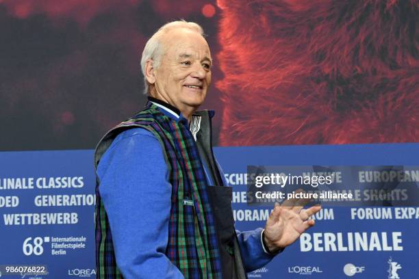 Actor Bill Murray smiles during the press conference of the film 'Isle of Dogs' during the Berlinale International Film Festival in Berlin, Germany,...