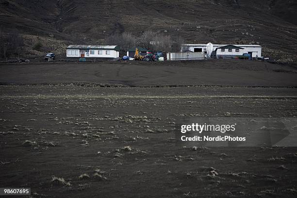 Farmhouses and sheds are surrounded by pasture destroyed by a thick layer of ash from the Eyjafjallajokull, on April 21, 2010 in Skogar, Iceland. The...