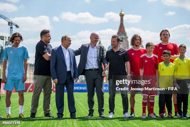 Alexey Smertin, Ronaldo, Vladimir Putin, Gianni Infantino, Lothar Matthaus, Carles Puyol and Dmitry Bulykin pose during Football Event in Red Square...