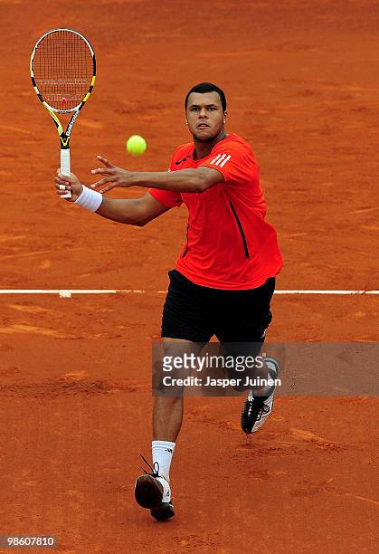 Jo-Wilfried Tsonga of France runs to play a forehand to Nicolas Almagro of Spain on day four of the ATP 500 World Tour Barcelona Open Banco Sabadell...