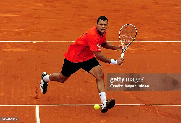 Jo-Wilfried Tsonga of France runs to play a forehand to Nicolas Almagro of Spain on day four of the ATP 500 World Tour Barcelona Open Banco Sabadell...